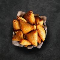 Samosa Factory · Triangle shaped deep fried pastry dumplings filled with spiced potatoes and vegetables