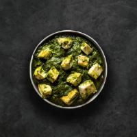 Spinach Cottage Cheese Curry · Slowly cooked farm-fresh spinach studded with perfectly fried cottage cheese cubes. Served w...