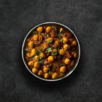 Savory Chickpeas Masala · Chickpeas cooked with farm-fresh vegetables and special herbs. Served with a portion of arom...