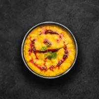 Dal Wave · Slow-cooked lentils tempered with herbs and whole red chillies.  Served with a portion of ar...