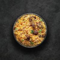 Yum Goat Biryani · Tender morsels of bone in goat meat cooked with our signature biryani masala gravy and long ...