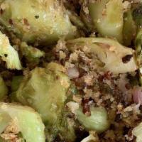 Brussel Sprouts · Sautéed in EVOO , red wine vinaigrette with pancetta and bread crumbs