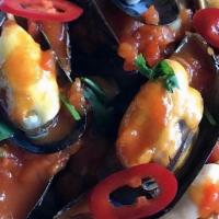 Mussels Pomodoro · Steamed black mussels with chives, onions, red wine reduction, house marinara, lots of garli...
