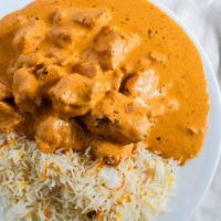 Butter Chicken · *POPULAR ITEM* Boneless 11-12 pieces of chicken, served in a creamy tomato sauce. Made from ...