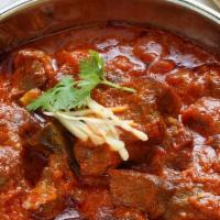 Lamb Rogan Josh · A smoky, lamb dish proportionately blended with natural yoghurt, to evoke spices and a sapid...