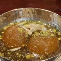 Gulab Jamoon · Milk and butter based sugar balls. Served hot with white almonds and pistachio!