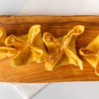 Crab Rangoon (6) · Fried and filled with cream cheese and imitation crab, served with sweet and sour sauce.