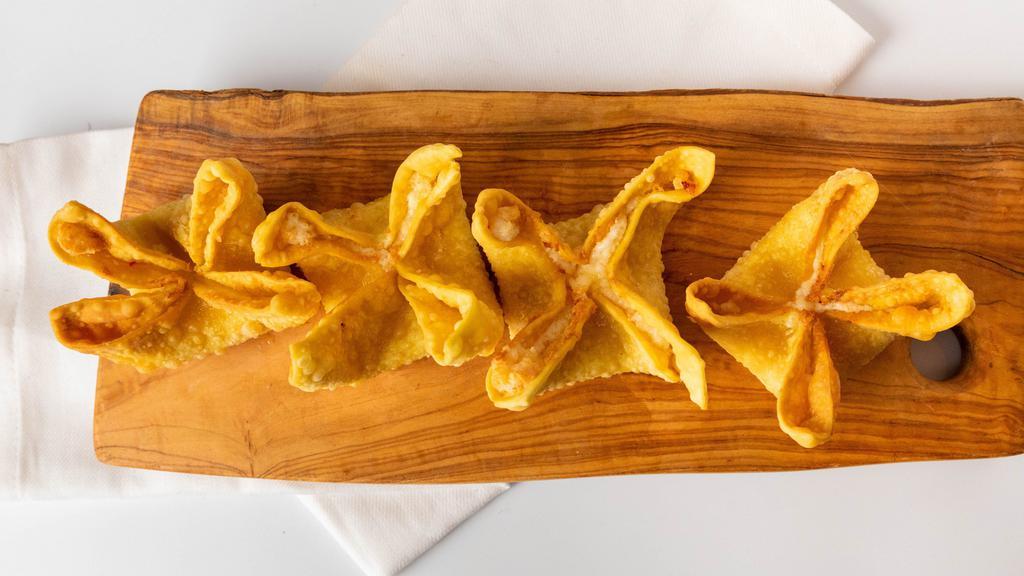 Crab Rangoon (6) · Fried and filled with cream cheese and imitation crab, served with sweet and sour sauce.