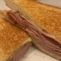 Ham Melt · honey cured ham with two slices of American cheese on thick cut white bread
