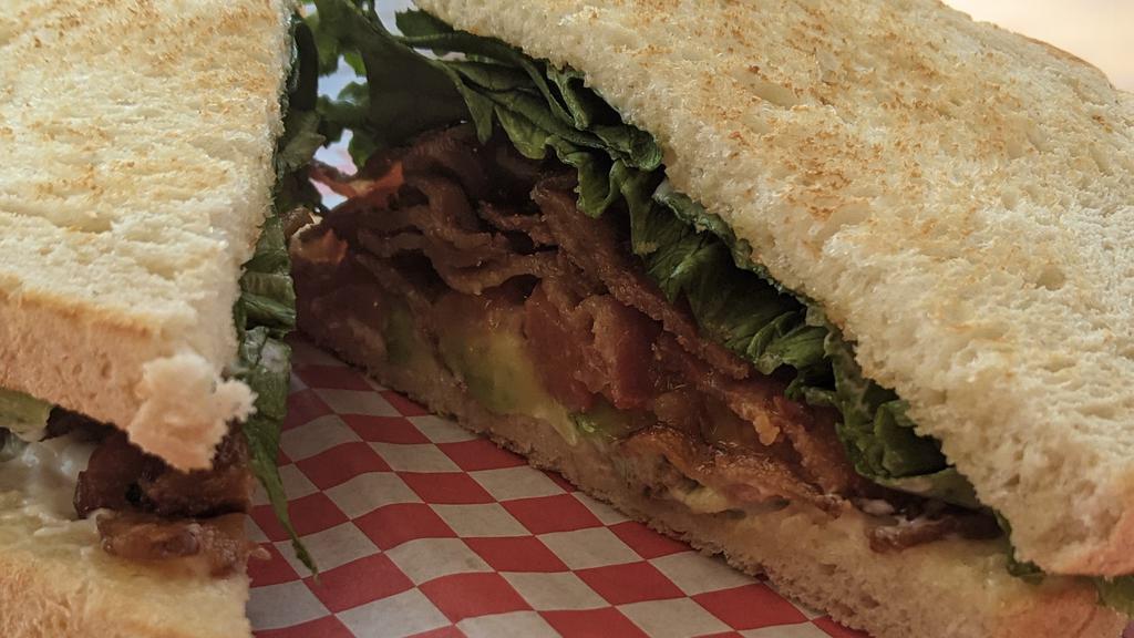 Blt · Thick cut bacon piled high with the classic lettuce, tomato and mayo served on toasted white sourdough.  *Try with Avocado.