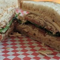 Chipotle Club · Our oven roasted turkey, thick cut bacon, Swiss cheese, lettuce, tomato, chipotle mayo, serv...