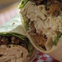 Chicken Caesar Wrap · Sliced chicken on a tortilla wrap with caesar dressing, crunchy croutons, lettuce, tomato an...