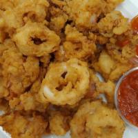 Calamari · Lightly fried calamari - served with Marinara and Tangy Thai sauce and banana peppers.   Han...