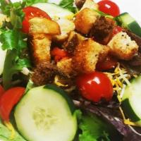 House Salad · Mixed greens, Cheddar Jack, cherry tomatoes, cucumbers, carrot, and seasoned croutons with c...