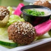 Falafel · Four deep-fried mixture of seasoned ground chick-peas and fava beans. Served with tahini sau...