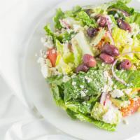 Feta Greek Salad · Romaine, tomatoes, cucumbers, red onions, feta cheese, kalamata olives in garlic/lemon dress...