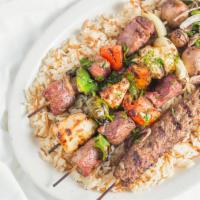 Skewered Kabobgy · (The ultimate kabob grilled platter) skewered chicken, beef, lamb, kabobs and kafta and gril...