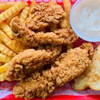 Chicken Tender Basket · 3 Chicken Tenders on a Bed of Fries with Toast and Gravy.