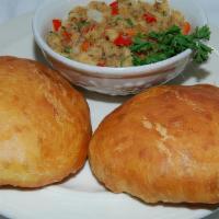 Fry Bake & Saltfish · Codfish sauteed with onions, garlic and sweet peppers and stuffed in a fry bake(dumpling)