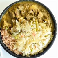 Curry Goat Dinner · Curry Goat, served with rice & peas, cabbage