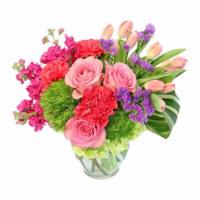 Blossoming Medley Floral Design · Brighten their day with this vibrant bouquet! With hot pink carnations, green hydrangeas, pi...