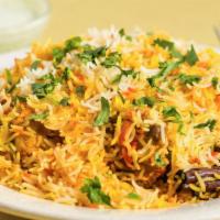 Chicken Biryani · Long grained basmati rice cooked with succulent pieces chicken blended with exotic herbs ser...