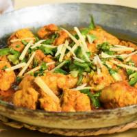 Bone In Chicken Karahi · Chicken cooked on very high heat in a wok with fresh tomatoes, onions, ginger, garlic, green...