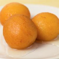 Gulab Jamun · Cardamon milk balls in sugar syrup.