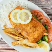 Salmon · Fried salmon, served with salad, white rice, fried potatoes.