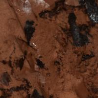 Michigan Pot Hole · Thick, black-tar fudge in chocolate ice cream with chunks of chocolate asphalt.