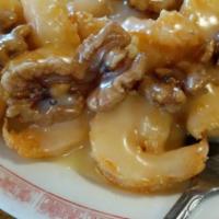 Walnut Shrimp · Tender shrimp fried in light batter & sauteed in a creamy sauce, served with honey walnuts.