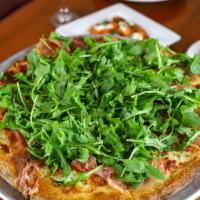 Franco'S · A white pizza with prosciutto di Parma, mozzarella, tomato, arugula, EVOO.