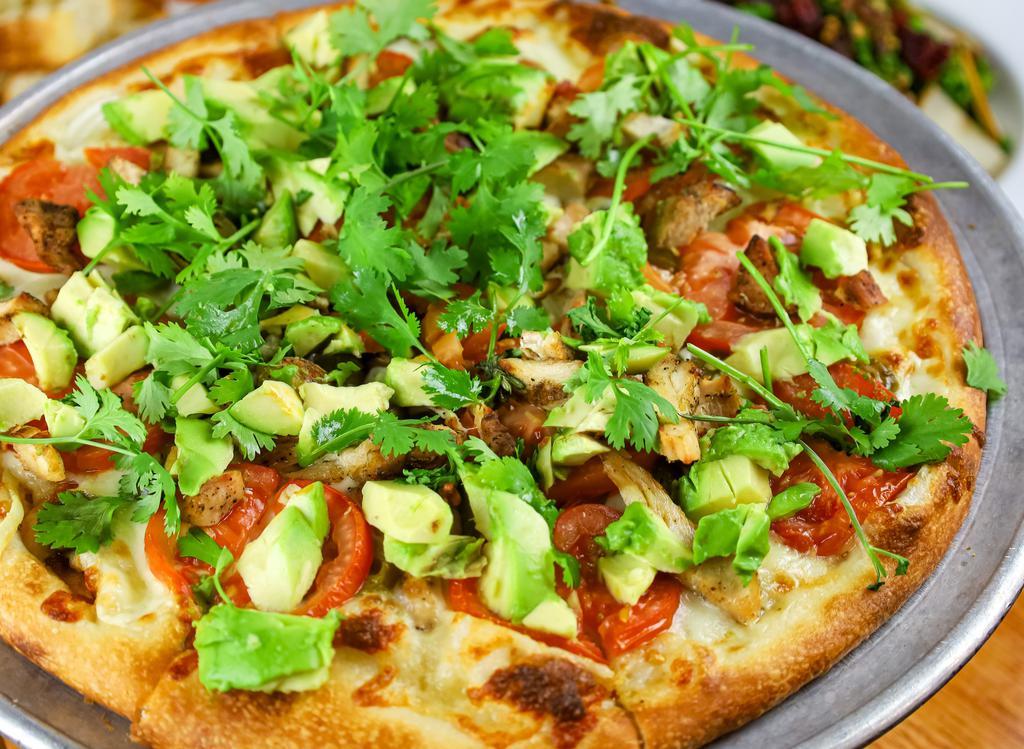 Tex Mex · White pizza with grilled chicken, jalapenos, cilantro, onion, avocado.