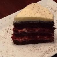 Red Velvet Cake · Red velvet cake layered with chocolate ganache and cream cheese frosting. Served with vanill...