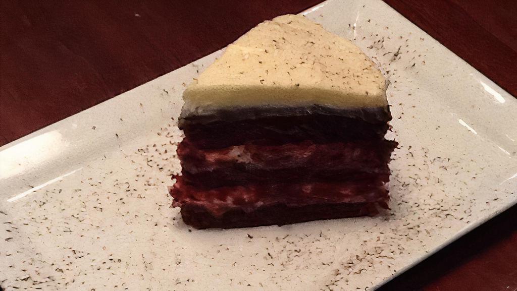 Red Velvet Cake · Red velvet cake layered with chocolate ganache and cream cheese frosting. Served with vanilla bean ice cream.