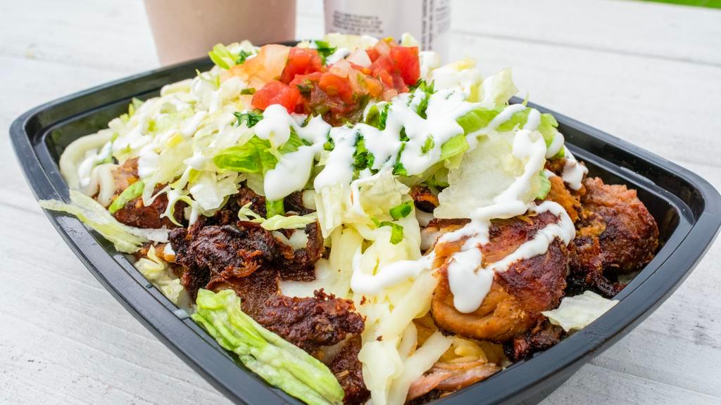 Steak · Steak strips, yellow rice, beans, pico, lettuce, sour cream, and cheese