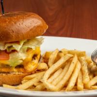 The Urban Burger · Twin 4 oz patties, American cheese, secret sauce, on a toasted brioche bun.