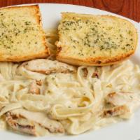 Chicken Alfredo Pasta · Homemade Alfredo sauce topped with grilled chicken and fettuccine pasta.