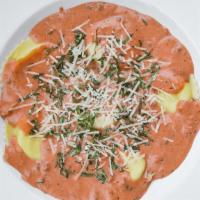 Cheese Ravioli · Six jumbo ravioli stuffed with ricotta, parmesan & romano cheeses, drenched in our rustic me...