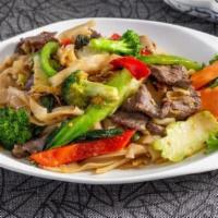 Phad Kee Mow (Drunken Noodle) · Flat noodles with egg, sweet basil, bell peppers, bok choy, Chinese broccoli, broccoli & mus...