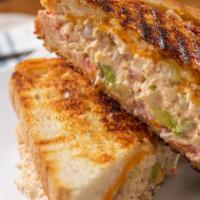 Tuna Melt Sandwich · Freshly made tuna sandwich with melted cheddar.