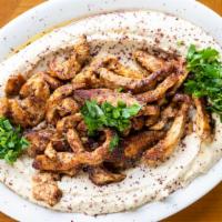 Hummus And Shawarma · A generous amount of hummus topped with your choice of beef or chicken shawarma. Available i...