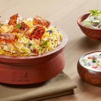 Hyd Egg Biryani · Spiced egg cooked with basmati and herbs.