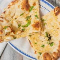  Garlic Naan · Soft flour bread stuffed with fresh garlic baked in clay oven.