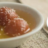 Gulabi Jamun · Deep fried cottage cheese balls, dipped in honey and sugar syrup.