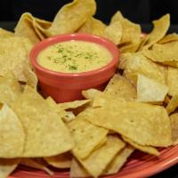 Chips & Dip · Seasoned tortilla chips with choice of one of our house made dips! Queso sauce, sweet and sp...