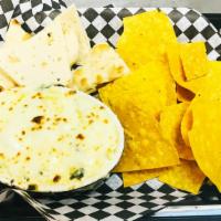 Spin Dip · Warm house made spinach & artichoke dip accompanied by our house seasoned tortilla chips & t...