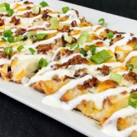 Baked Potato Flat Bread · Mashed potatoes, Alfredo sauce, applewood smoked bacon and cheddar cheese. Finished with sou...