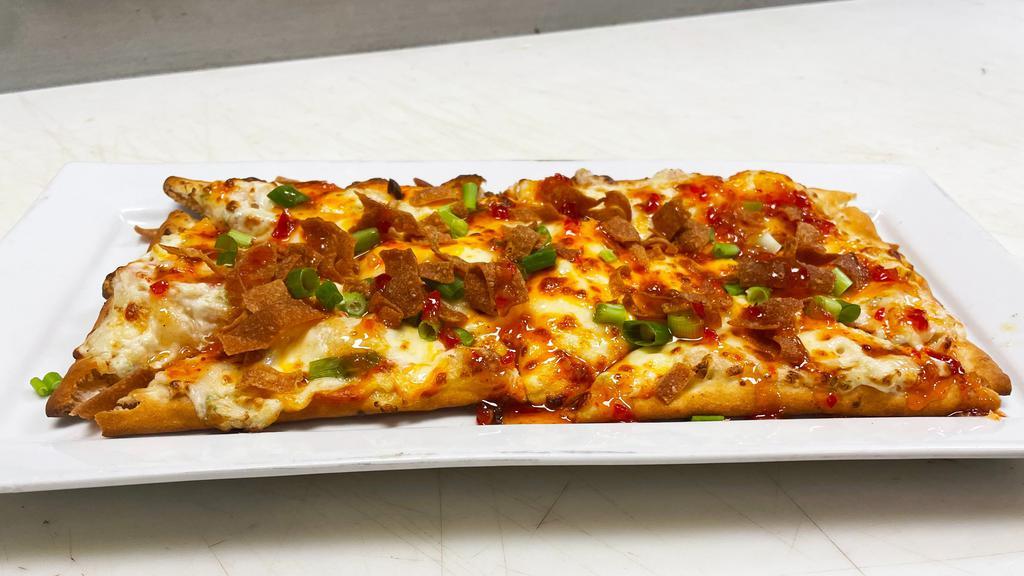 Krab Rangoon Flat Bread · Cream cheese crab rangoon mixture topped with a five cheese blend and finished with green onions, fried wontons and Thai chili sauce.