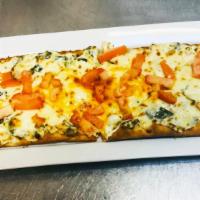 Spin & Art Flat Bread · Our house made spinach and artichoke dip topped with mozzarella, finished with fresh tomatoes.